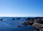 安房崎灯台付近の岩場から伊豆半島・伊豆大島の写真